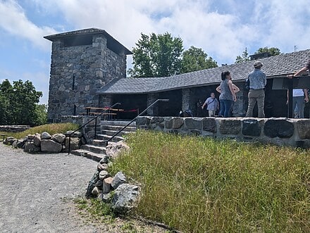 View of Eliot Tower with a planted berm in the foreground.